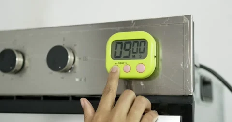 Hand press timer digital the oven for cooking. Stock Footage 154856835