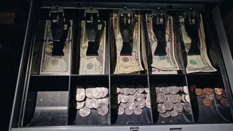 Hand presses button and cash register drawer opens, revealing banknotes and Stock Footage 324865818