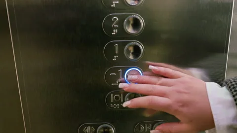 Hand Presses Button on Elevator Control Panel Stock Footage 310147861