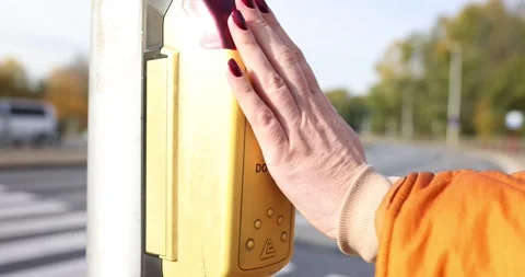 Hand presses button on pedestrian crossing and turns on green light of traffic Stock Footage 255811552