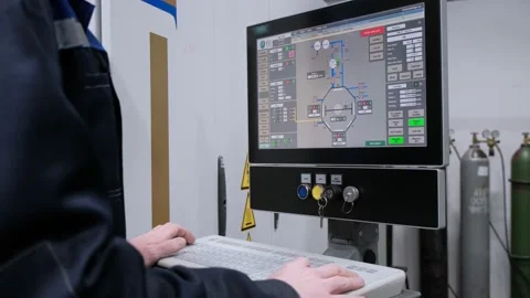 The hand presses the control buttons of the machine at the factory. The control Stock Footage 172014380