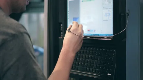 The hand presses the control buttons of the machine at the factory. The control Stock Footage 172014629