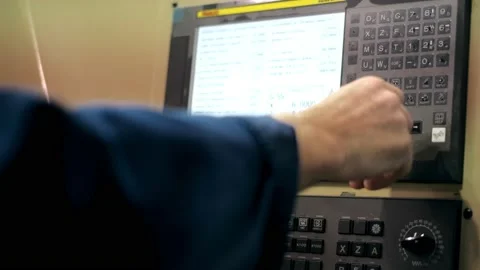The hand presses the control buttons of the machine at the factory. The control Stock Footage 172016841