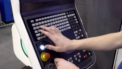 The hand presses the control buttons of the machine at the factory. The control Stock Footage 172017019