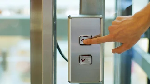 Hand presses the elevator button. Concept of choice Stock Footage 116540407