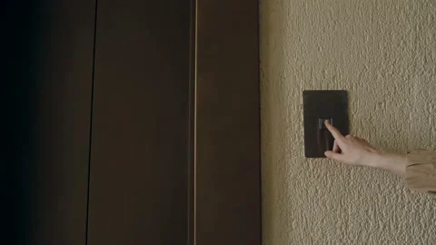 Hand presses the elevator call button close-up Video stock 131263150
