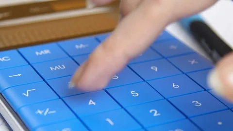 Hand presses keys of the calculator. calculation of profit or loss Stock Footage 88992503
