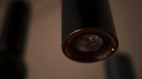 A hand presses the light switch in a hotel room. The light turns on and off Stock Footage 164559355