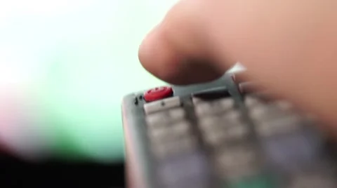 Hand presses "Power Off" remote control and switches off TV a close-up shot Stock Footage 58604966