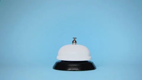 The hand presses reception call on a blue background. hotel service. Stock Footage 132352108