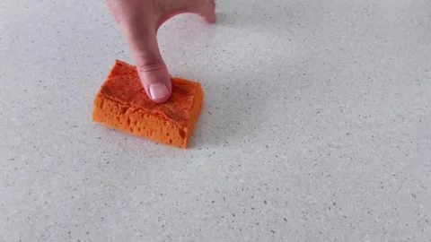 Hand Presses Soft Sponge to Show Texture and Flexibility Stock Footage 320452051