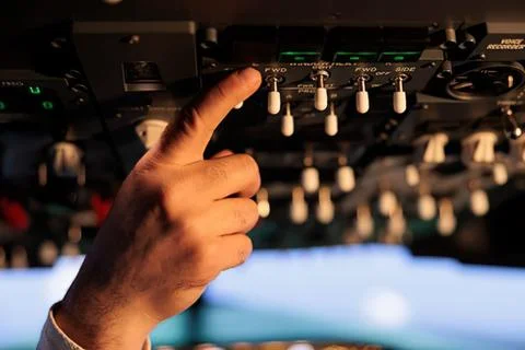 Hand pressing arcade machine button Stock Photos