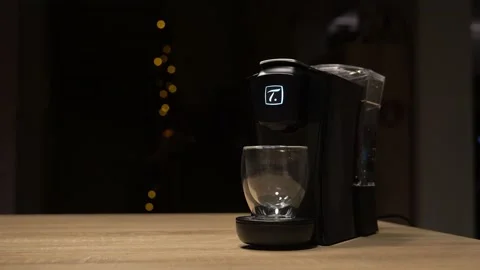 Hand pressing blinking button on tea machine Stock Footage 144440848