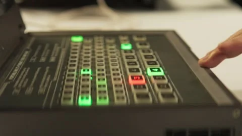 Hand pressing broadcast switcher panel button Stock-Footage 345861038