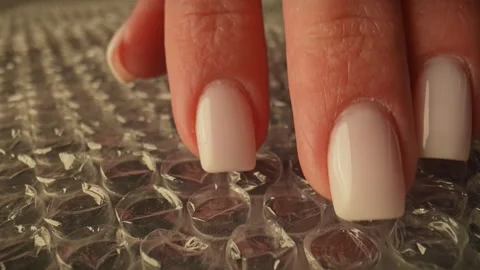 Hand Pressing Bubble Wrap for Relaxation and Stress Relief Stock Footage 309295339