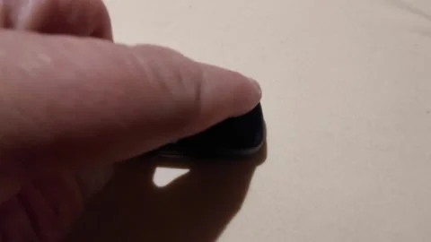 Hand pressing button on car key fob to flip out the key blade Vídeos de archivo 333641499