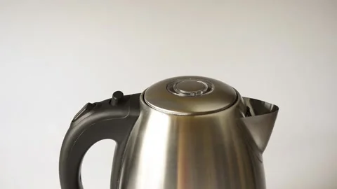 Hand is pressing the button of the electric kettle to open the lid. Stock Footage 140747240