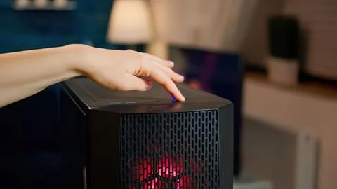 Hand pressing button on modern heater with red light Stock Photos