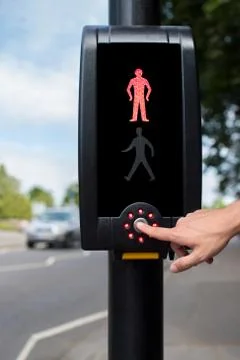 Hand Pressing Button On Pedestrian Crossing Stock Photos