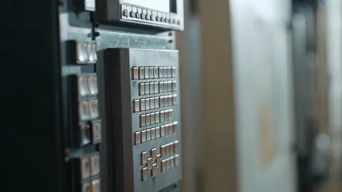 A hand pressing on a button to set up an automated machine system in an factory. Stock Footage 330398074