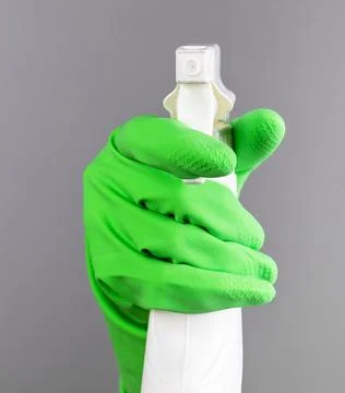 Hand pressing button of sprayer package, spraying detergent, cleaning liqui.. Stock Photos