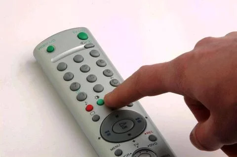 Hand pressing button tv Stock Photos