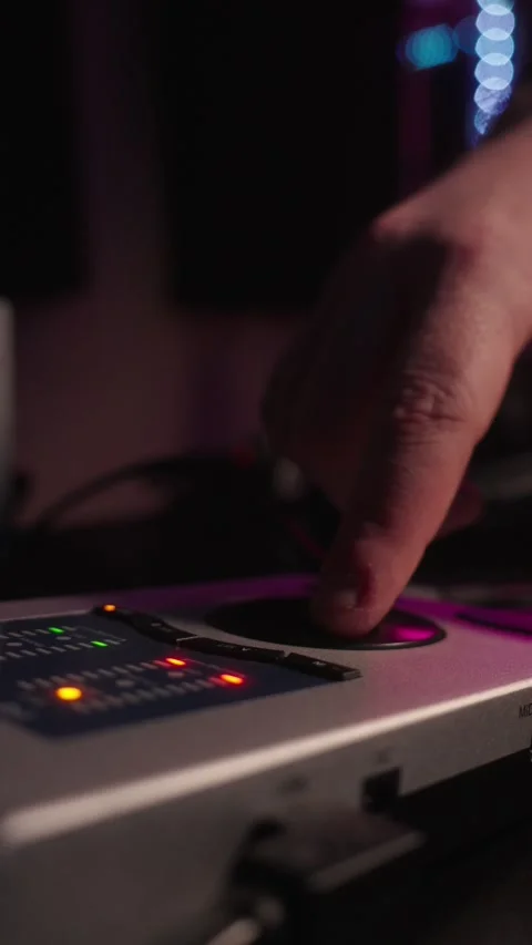 Hand pressing buttons on audio interface in recording studio close up vertic Stock Footage 332984273