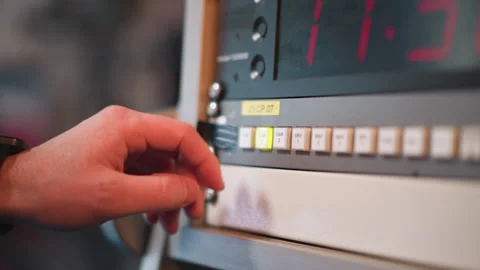 Hand pressing cam 3 button on broadcast control panel with timer display Stock Footage 317537935