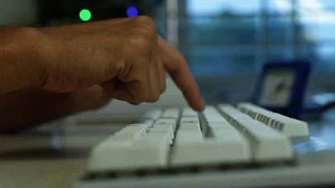 Hand Pressing Computer Keyboard in Office, Close-up of a hand pressing a wh.. Stock Footage 345119267
