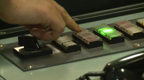 Hand pressing different buttons on the bridge of a cargo ship. Stock Footage 66450146