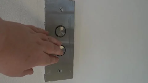 Hand pressing elevator button on metal panel. Stock Footage 326015540