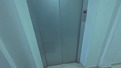 Hand Pressing Elevator Button in Modern Office Building Interior 動画素材 334086871