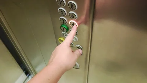 Hand pressing floor button in elevator, close-up. Service lift Stock Footage 295603536