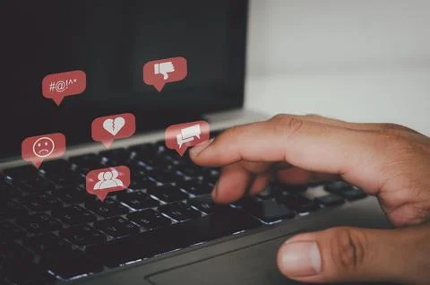 Hand pressing the keyboard of a laptop computer. Icon virtual interface tec.. Stock Photos