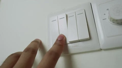Hand Pressing Light Switch on Wall Stock Footage 317737291