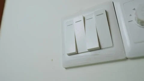 Hand Pressing Light Switch on Wall Stock Footage 317737307