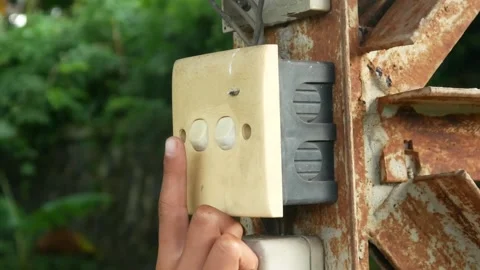 Hand pressing the outdoor light switch button. Stock Footage 310114805