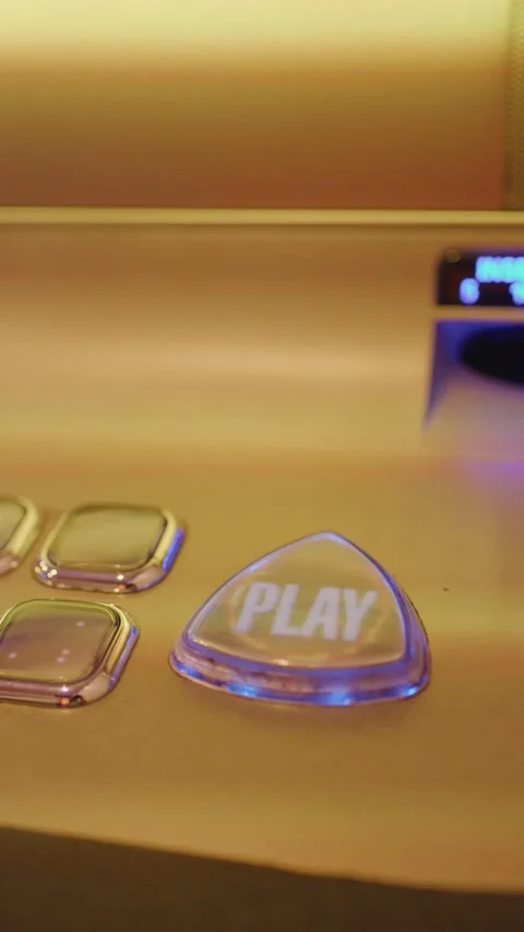 Hand Pressing Play Button on Casino Slot Machine Console Stock Footage 316651699
