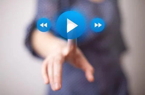 Hand pressing play button 스톡 사진