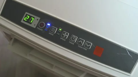 Hand Pressing Power Button on Air Conditioner Control Panel Stock Footage 342278231