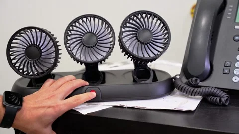Hand Pressing Power Button On Desk Fan Stock Footage 341396209