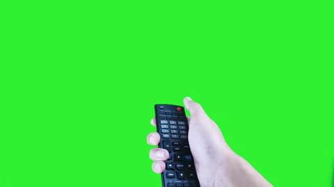 Hand pressing red power button on television remote isolated on green screen Stock Footage 322770640