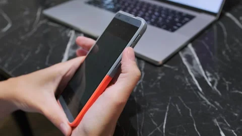 Hand pressing smartphone side button, close-up of activating mobile device Stock Footage 333649751