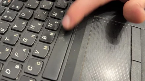Hand pressing space bar on old laptop keyboard, using outdated portable computer Stock Footage 337121443