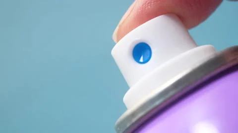 Hand pressing a spray bottle with liquid 動画素材 145740705
