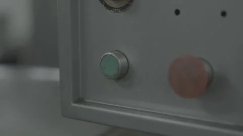 Hand pressing start button on industrial machine Stock-Footage 327356699