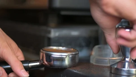 Hand pressing tamper Stock Footage 121132501