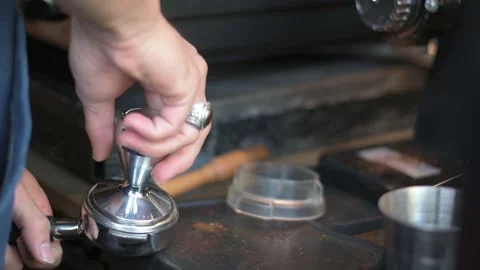 Hand pressing tamper Stock Footage 146833706