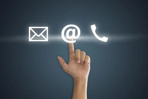 Hand pressing telephone, email button icon over blue background. Customer sup Stock Photos