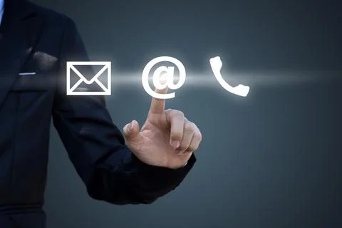 Hand pressing telephone, email button icon over blue background. Customer sup Stock Photos